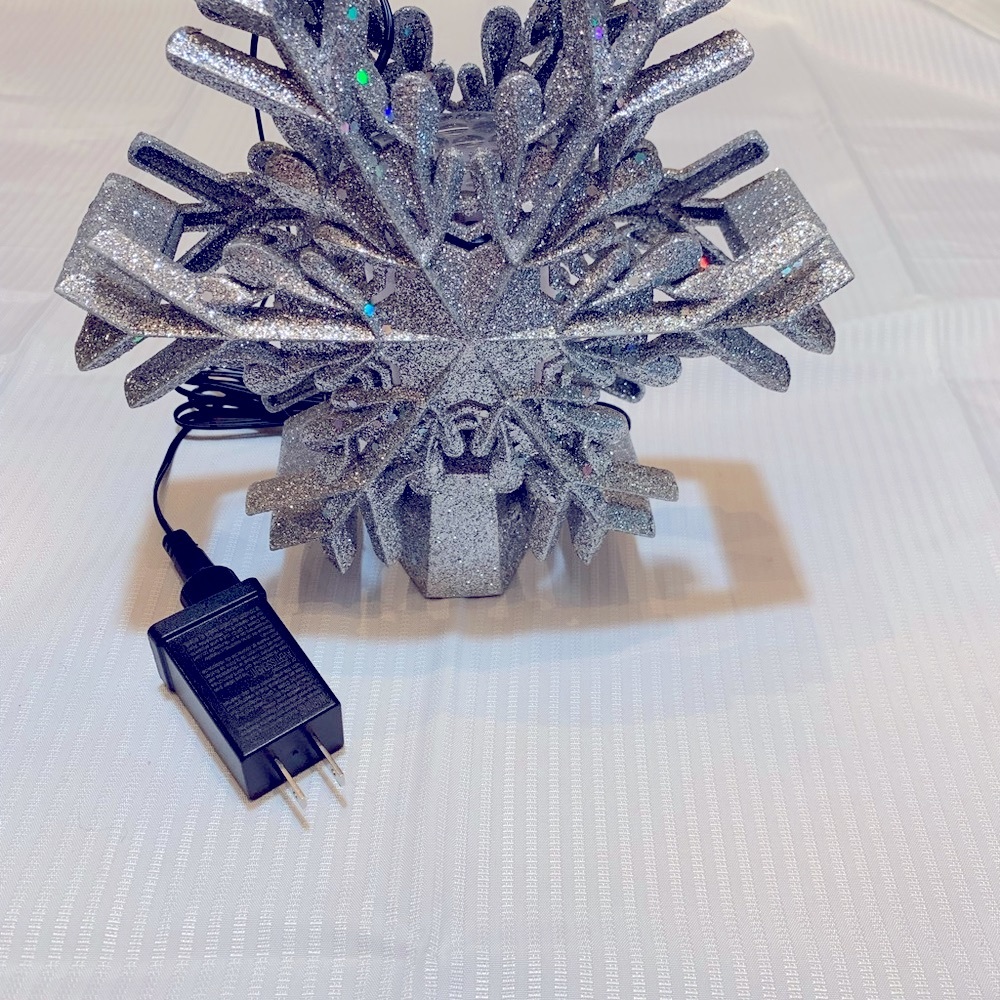 Snowflake Christmas Tree Topper Lighted with Built-in Rotating LED Projector.